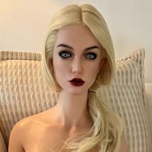 A blonde woman with striking makeup and intense expression.